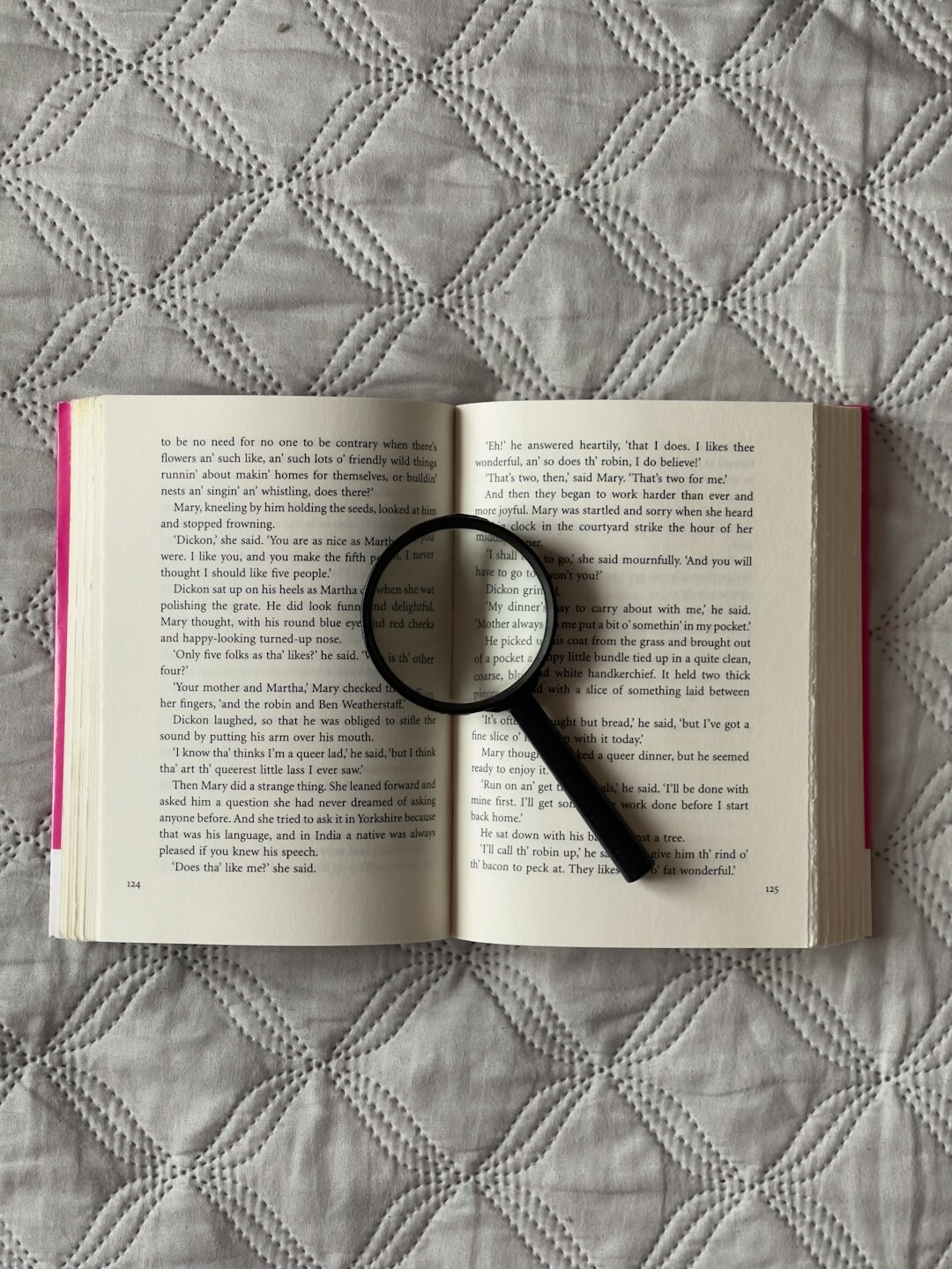 open book with magnifying glass